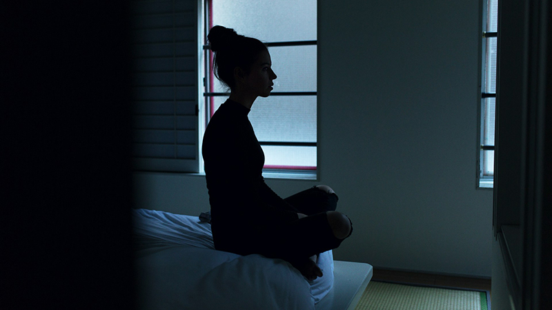 Psychiatric care in Tulsa - woman sitting in dark depression